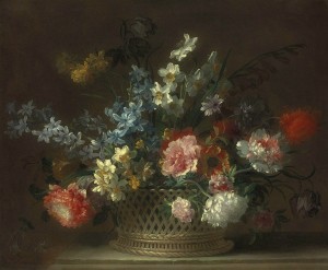 Roses, daffodils, hyacinths, anemones, fritillaries and other flowers in a woven basket